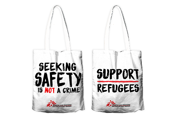 Médecins Sans Frontières / Doctors Without Borders tote bag with "Seeking Safety Is Not A Crime" written on the front and "Support Refugees" on the back.
