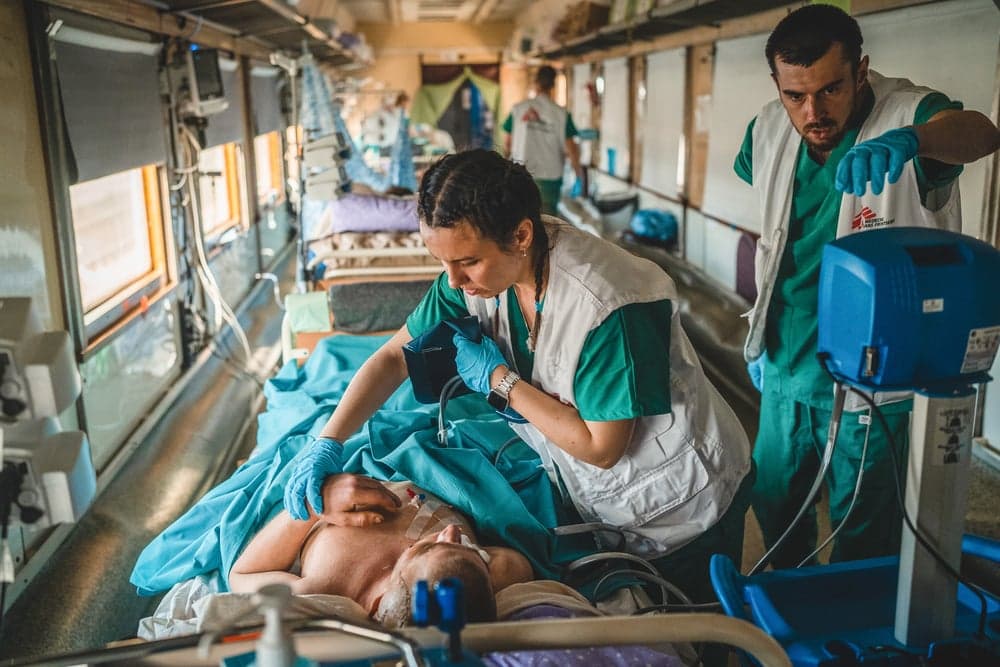 The MSF medical team inside the intensive care unit MSF medical train monitor and stabilize a war-wounded patient in Ukraine.
