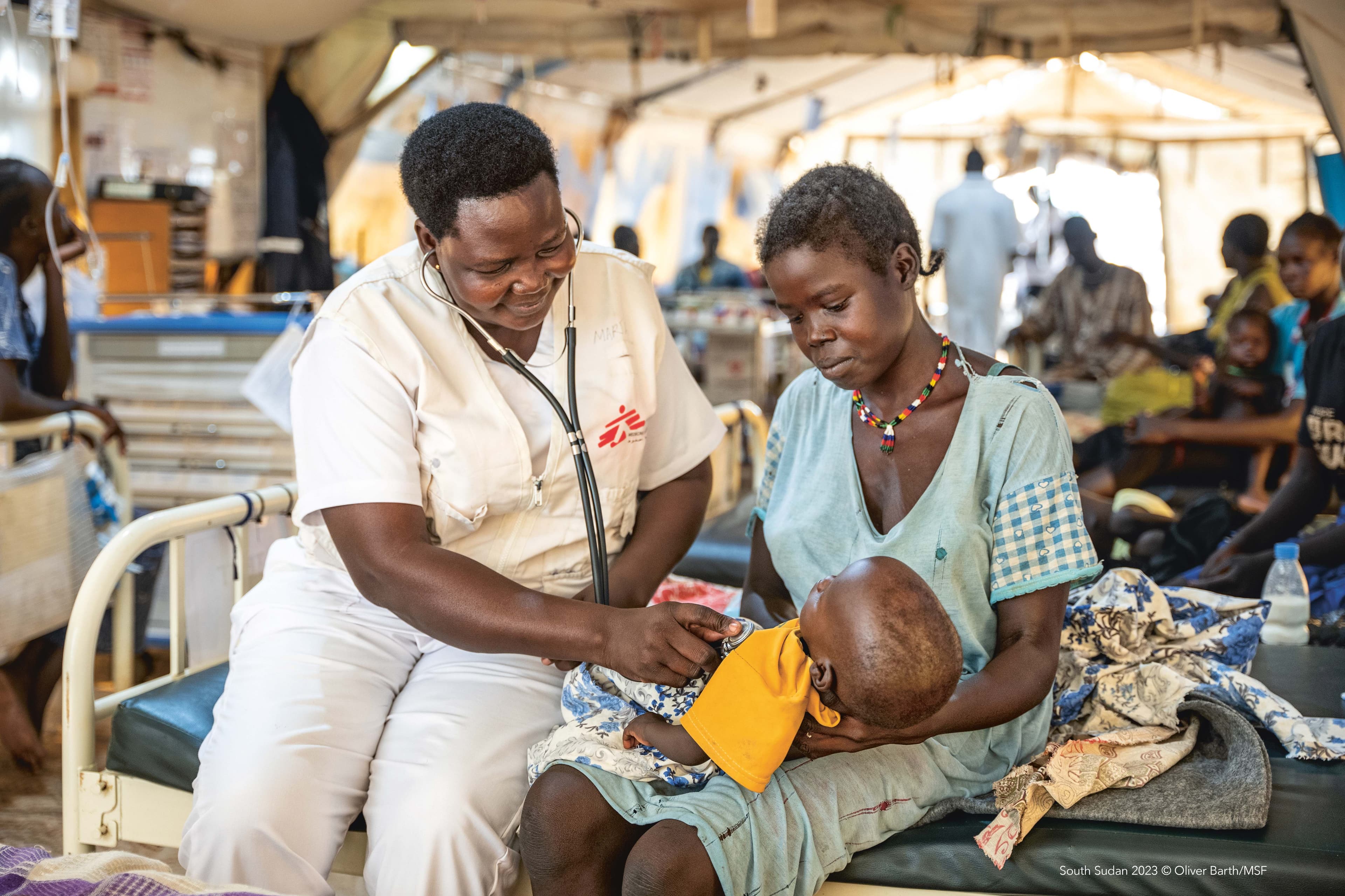Doctors Without Borders / Médecins Sans Frontières staff examine a patient suffering from malnutrition. Photo is from South Sudan.