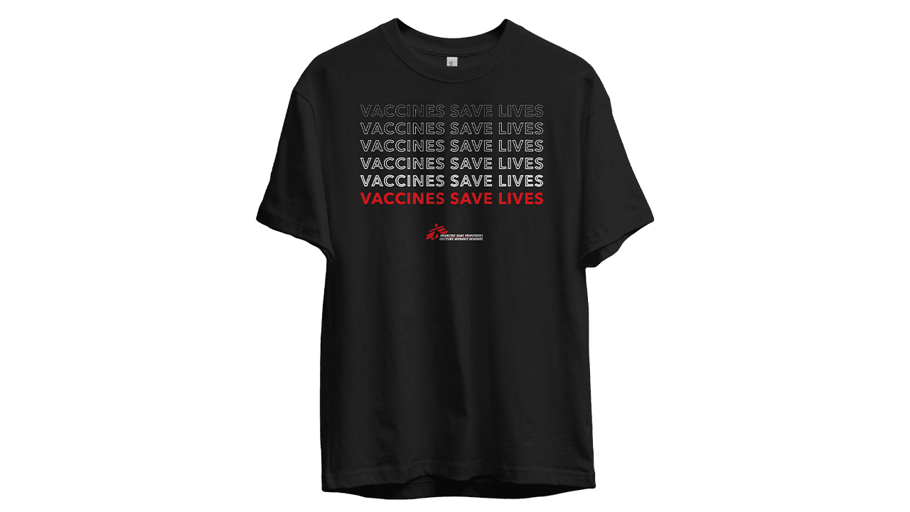 Cream-colored t-shirt with a custom hands and heart design that says "Compassion Has No Borders"